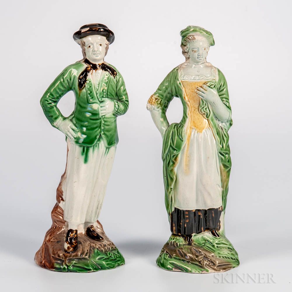 Appraisal: Pair of Staffordshire Lead-glazed Figures Pair of Staffordshire Lead-glazed Figures