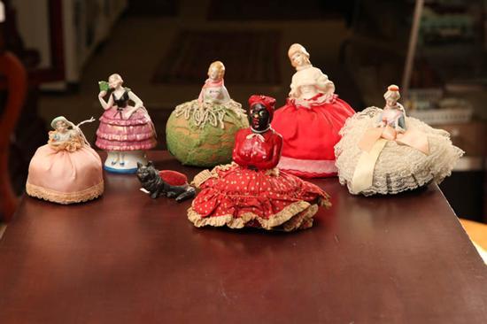 Appraisal: SEVEN PIECES Mammy pincushion doll h Four blond porcelain doll