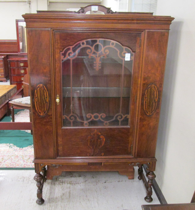 Appraisal: WALNUT CHINA CABINET ON STAND American c s single glass