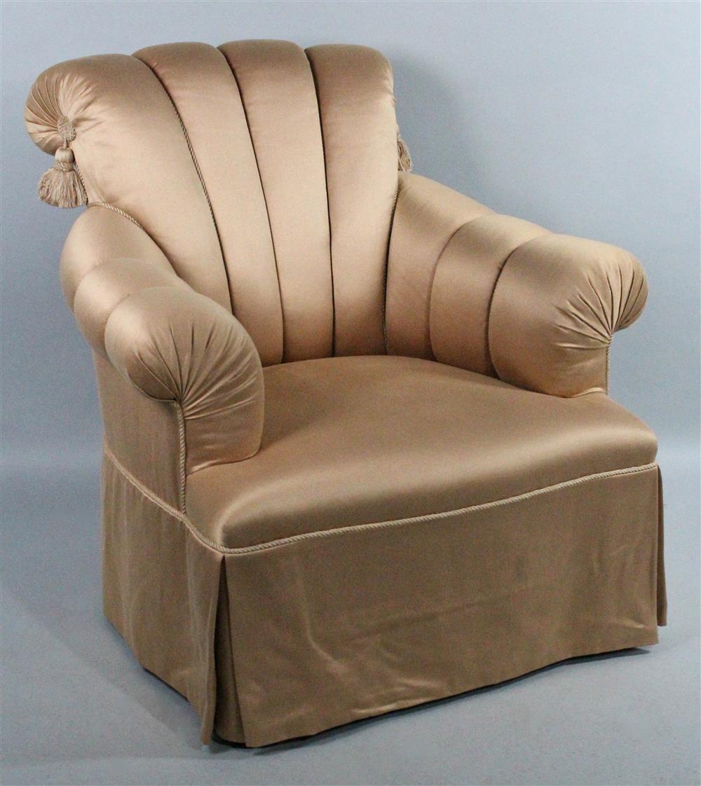 Appraisal: CHANNEL UPHOLSTERED CLUB CHAIR WITH TASSEL TRIM peach upholstery with