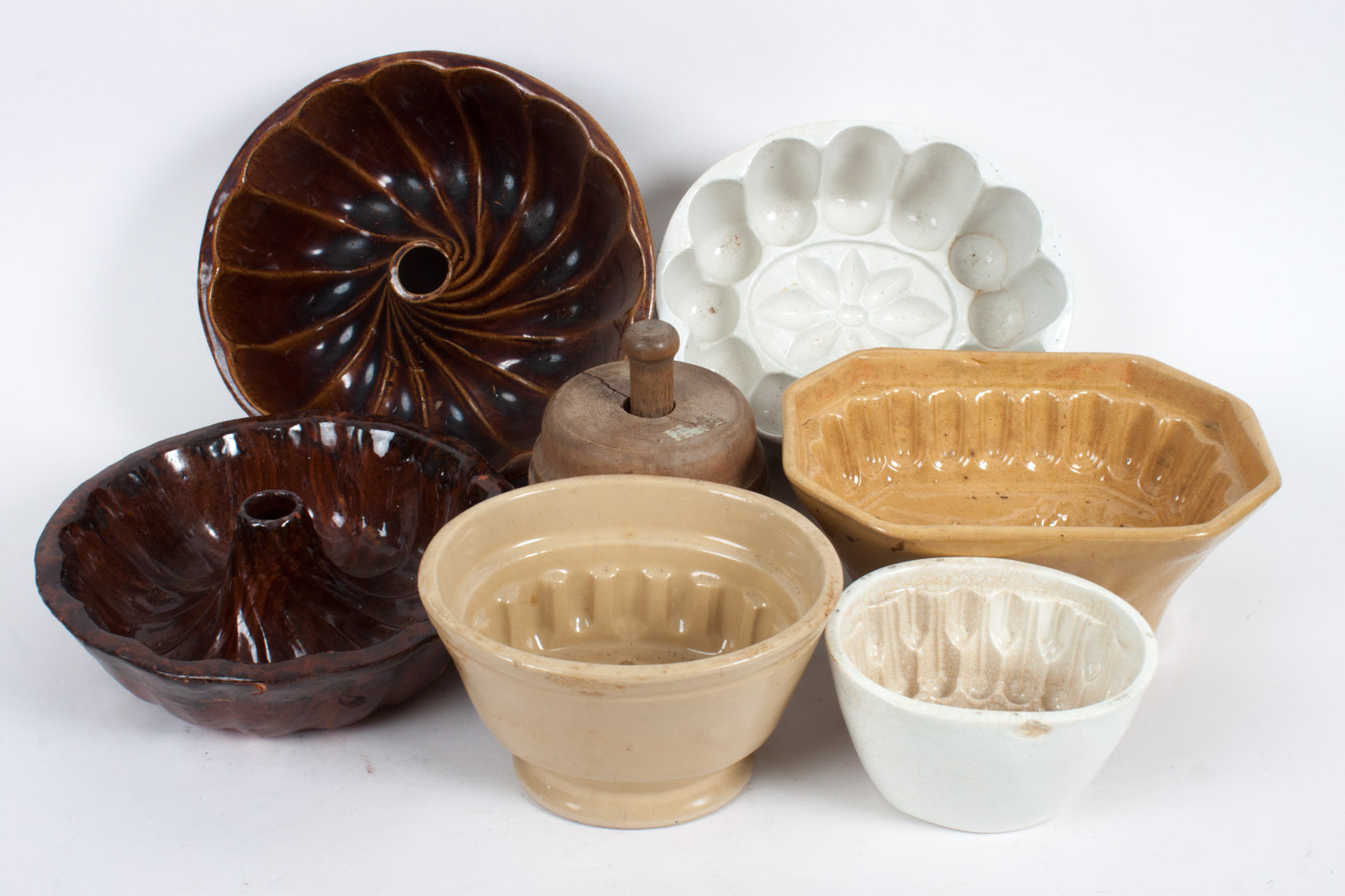 Appraisal: Six Victorian pudding molds and a butter press second half-