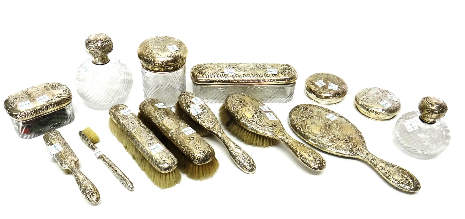 Appraisal: A French silver mounted part dressing table service comprising two