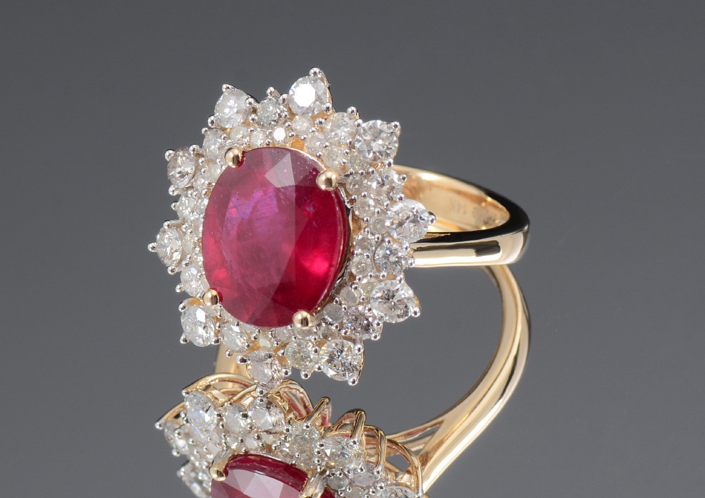 Appraisal: K RUBY AND DIAMOND RING K yellow gold ring centering