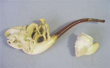 Appraisal: Two carved ivory meerschaum pipesprobably austrian th century