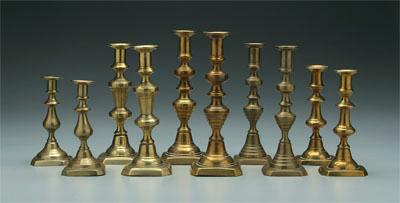 Appraisal: Five pairs brass pushup candlesticks all with canted corner bases