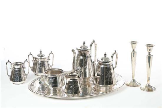 Appraisal: VICTORIAN SILVER PLATE TEA SET AND CANDLESTICKS Tea set manufactured