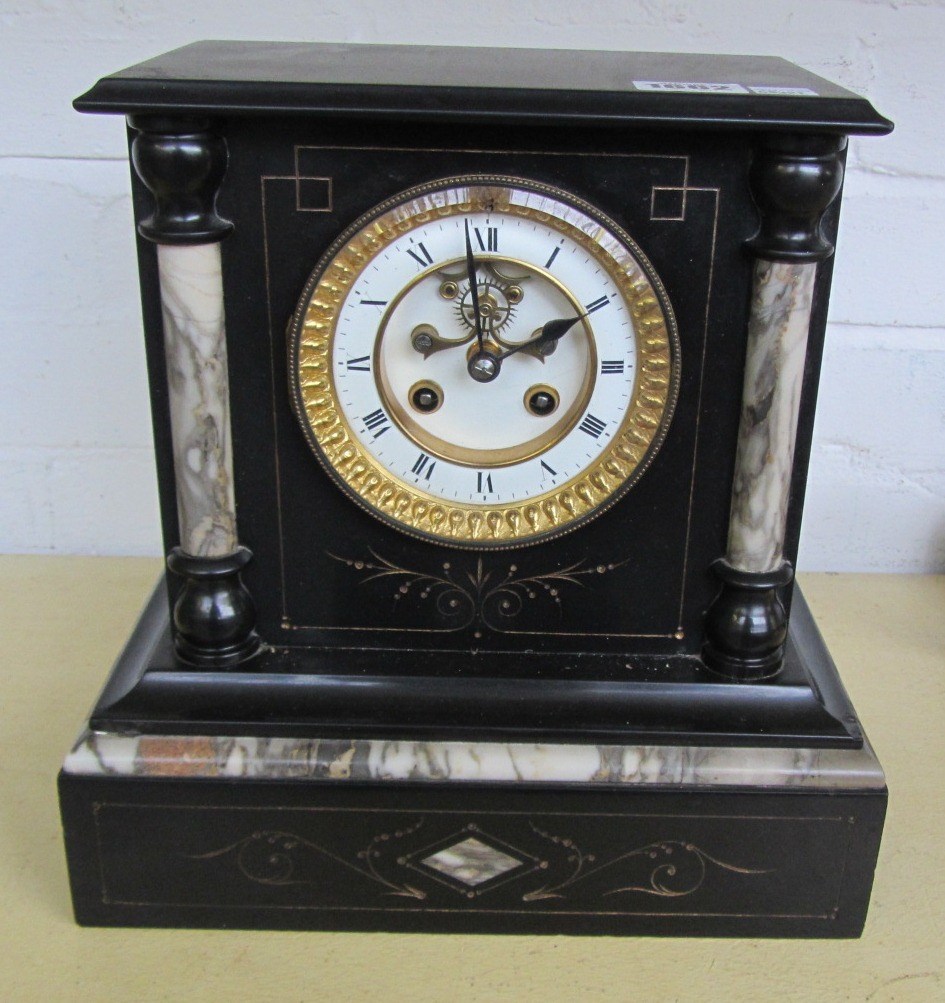 Appraisal: A Victorian black slate cased mantel clock on a plinth