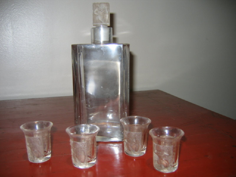 Appraisal: LALIQUE FRANCE Five-piece molded glass ensemble comprising a decanter with