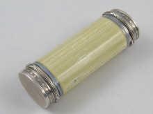 Appraisal: A lemon yellow enamelled silver oval cylinder with silver lid