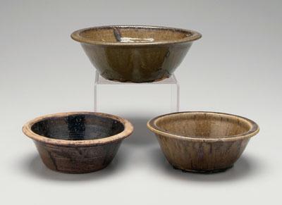 Appraisal: Three alkaline glaze bowls one with flattened rim visible turning