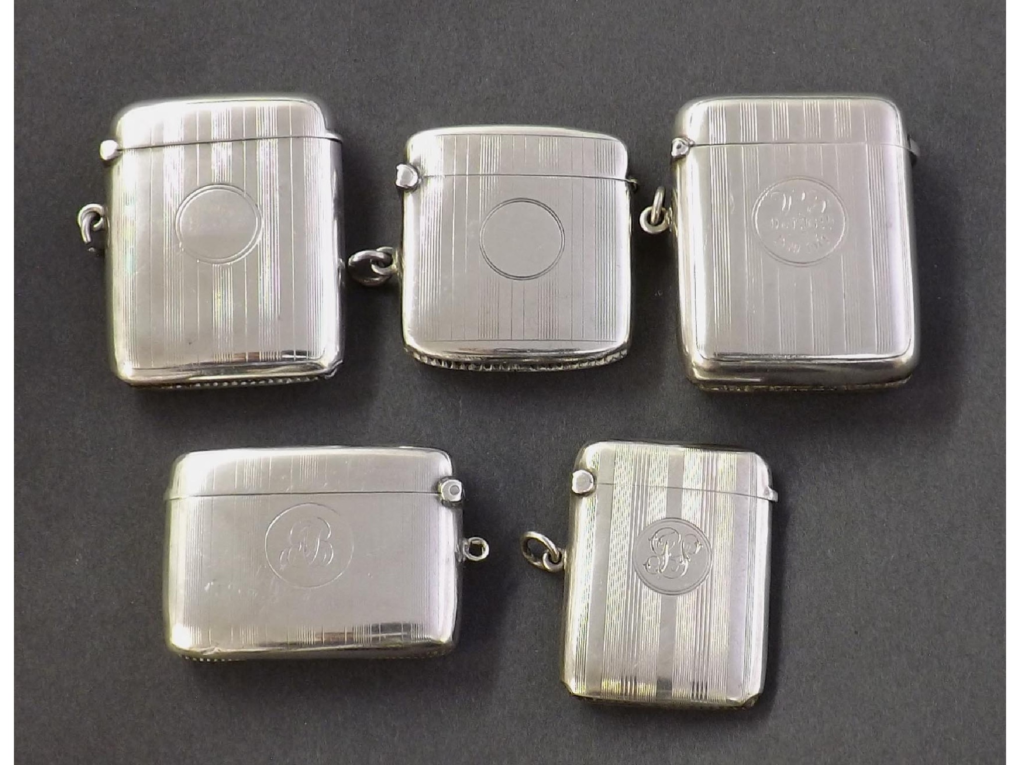 Appraisal: Five silver vesta cases each with engine turned pin stripe