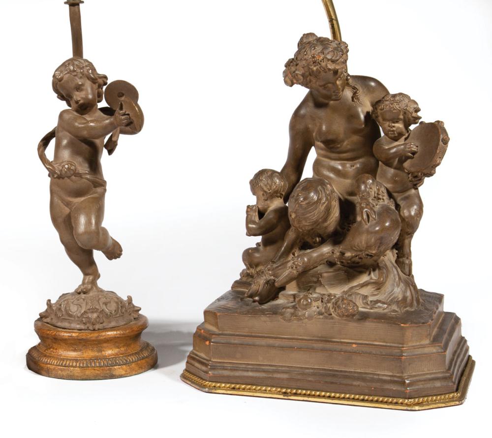 Appraisal: Two Patinated Terracotta Figural Lamps one with satyr and putti