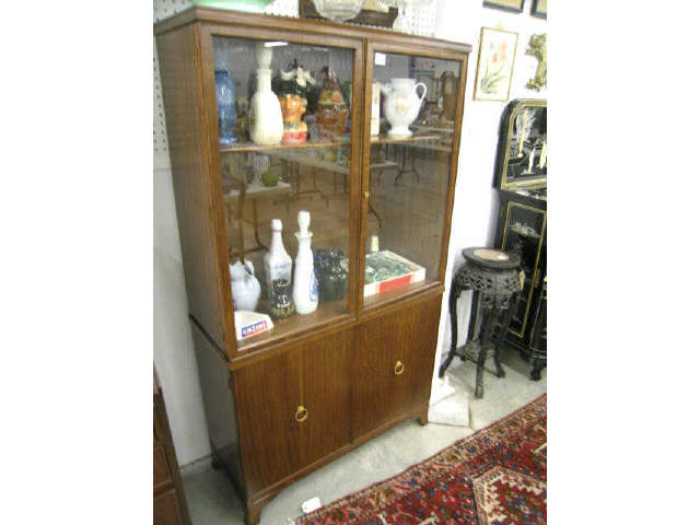 Appraisal: Mahogany Bookcase double glass doors over lower solid doors