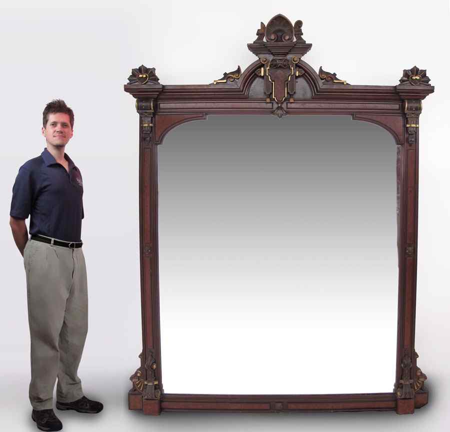 Appraisal: LARGE RENAISSANCE REVIVAL WALNUT MIRROR Frame with applied carved decoration