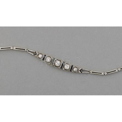 Appraisal: ART DECO DIAMOND AND ONYX BRACELET Platinum-topped gold five diamond