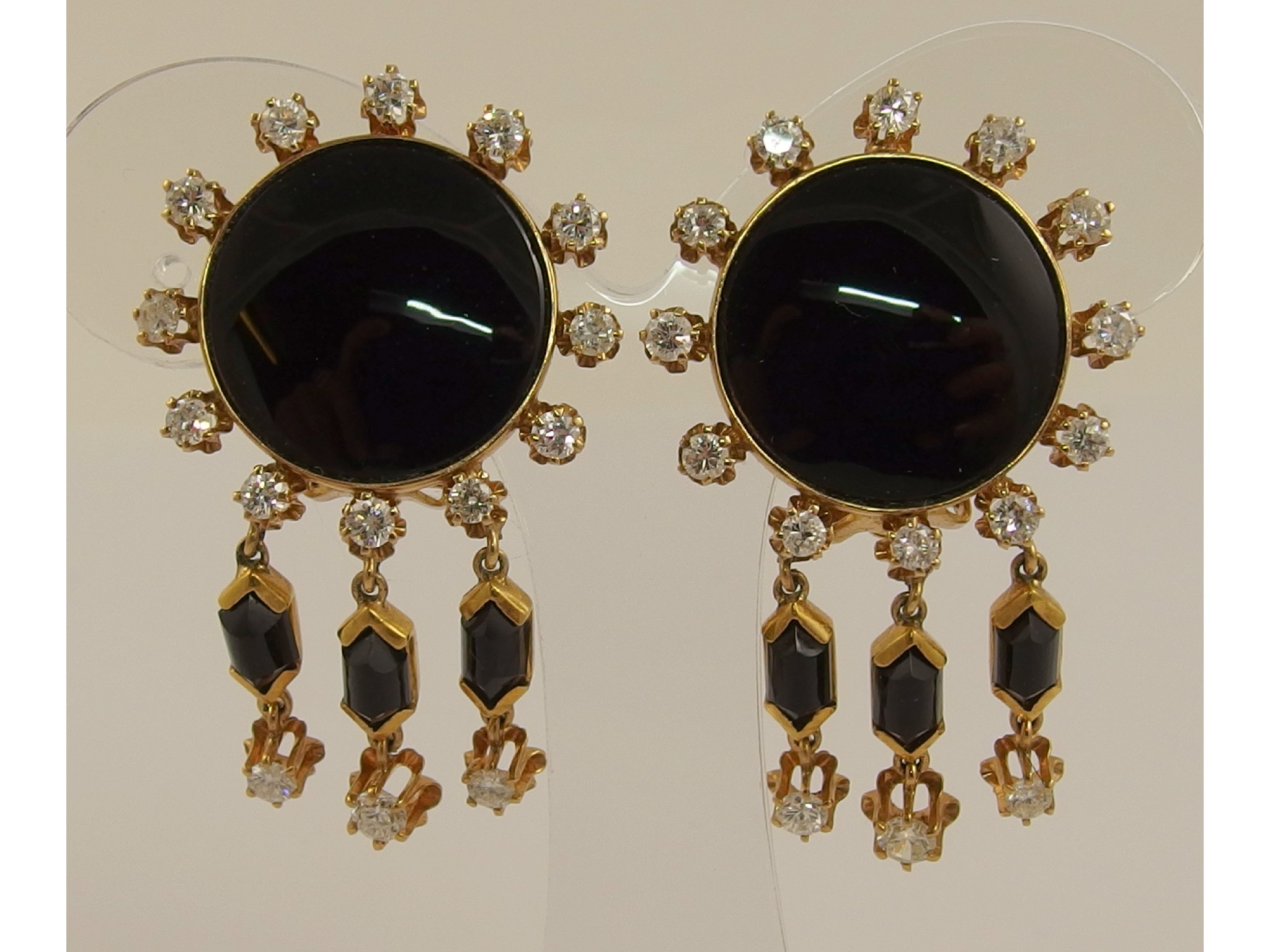 Appraisal: A pair of ct diamond and onyx ear clipsthe circular