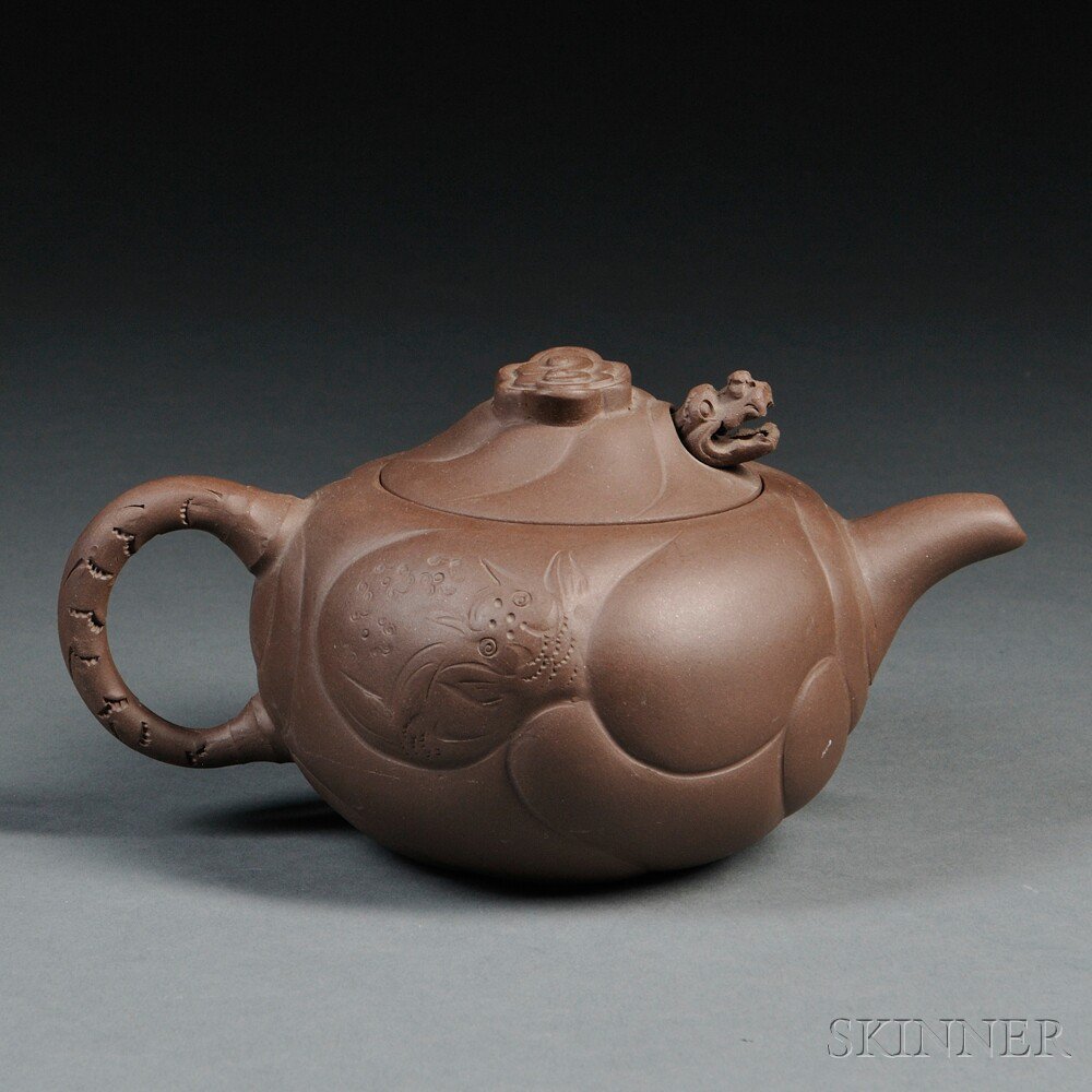 Appraisal: Yixing Teapot China ovoid with dragon decoration and a finial