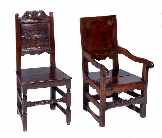 Appraisal: AN ANTIQUE OAK HALL CHAIR with panel back and solid