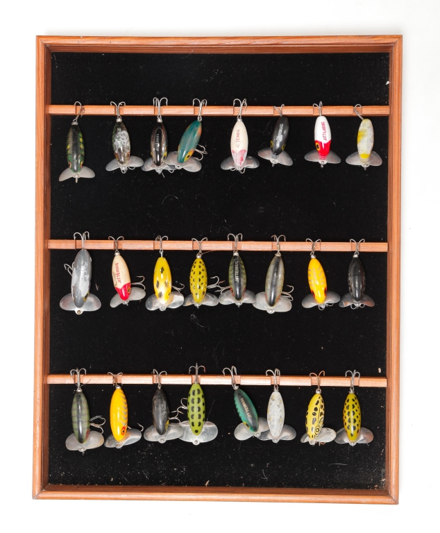 Appraisal: TWENTY-FOUR JITTERBUG LURES IN DISPLAY CASE Third quarter th century