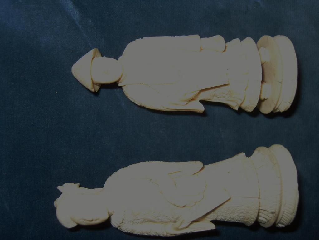 Appraisal: A pair of th century eastern carved ivory figures showing