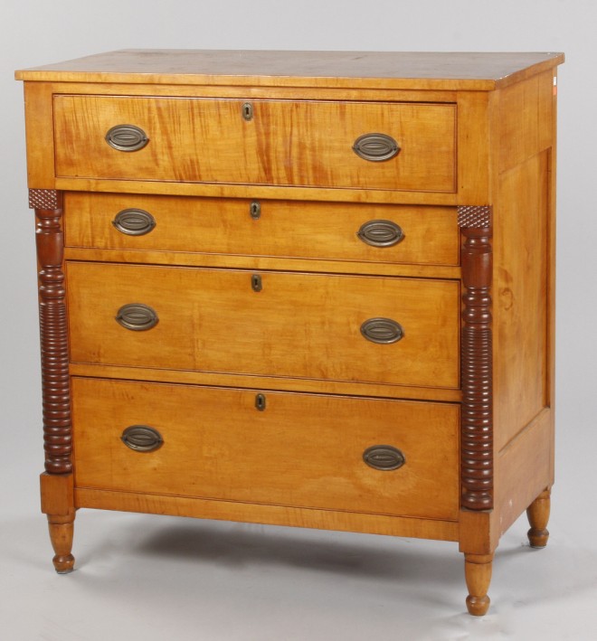 Appraisal: Figured cherry four drawer chest Applied walnut turned pilasters turned