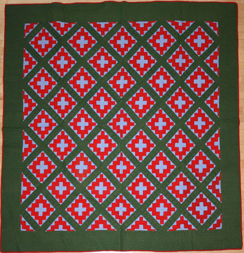 Appraisal: Pennsylvania red green and blue calico pieced quilt in a