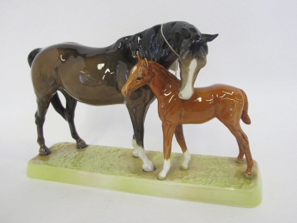 Appraisal: Beswick brown mare and chestnut foal group no