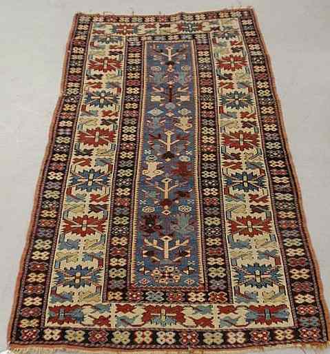 Appraisal: Colorful Caucasian oriental mat with blue center stylized potted flowers