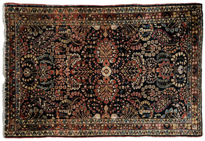 Appraisal: Sarouk rug typical floral designs on dark blue ground possibly