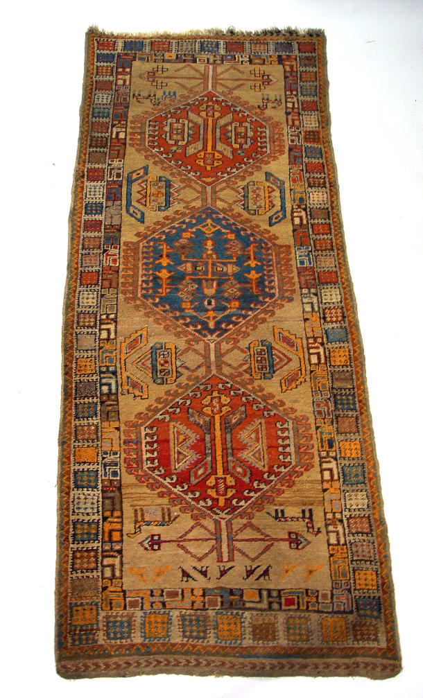 Appraisal: Old yellow ground carpet runner with colourful geometric patterning cm