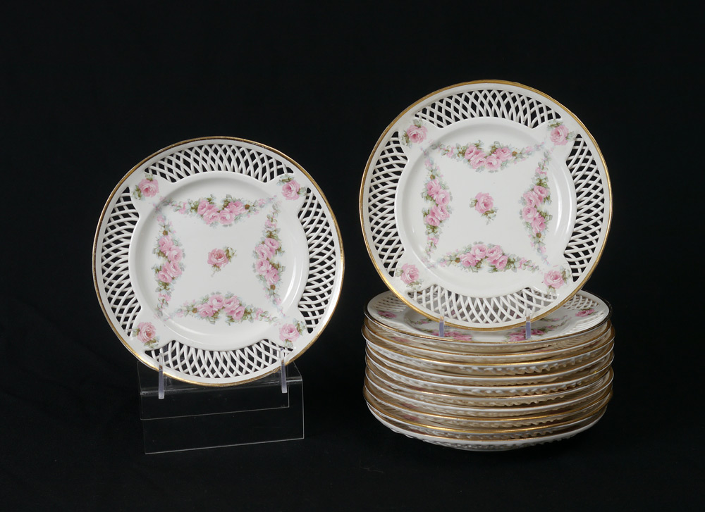 Appraisal: MAX ROESLER RETICULATED FLORAL PLATES Floral swag design with reticulated