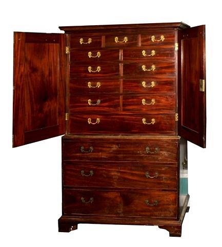 Appraisal: A George III mahogany cabinet on chest the two sections