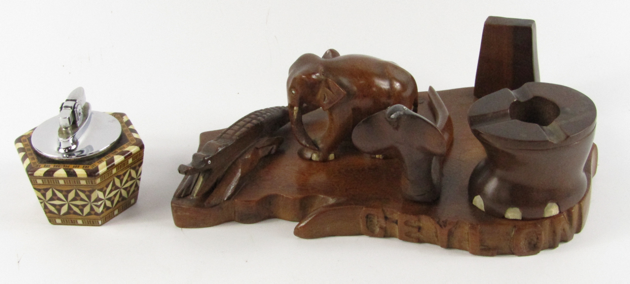 Appraisal: A mid thC hardwood smoker's companion carved with an elephant's