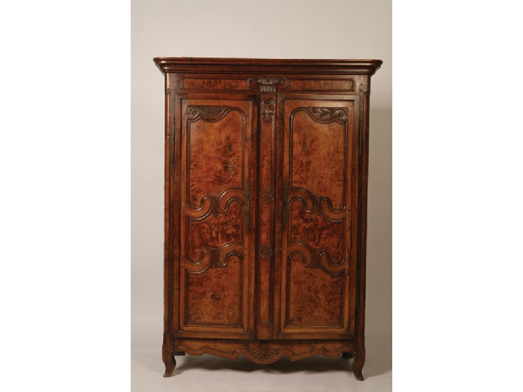 Appraisal: A CONTINENTAL WALNUT ARMOIRE late th early th century the