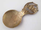 Appraisal: A modern silver Art Nouveau caddy spoon unmarked but probably