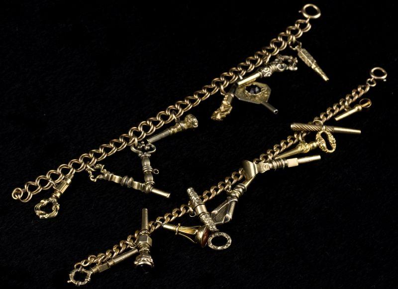 Appraisal: Two Watch Fob Gold Charm Bracelets the first on a