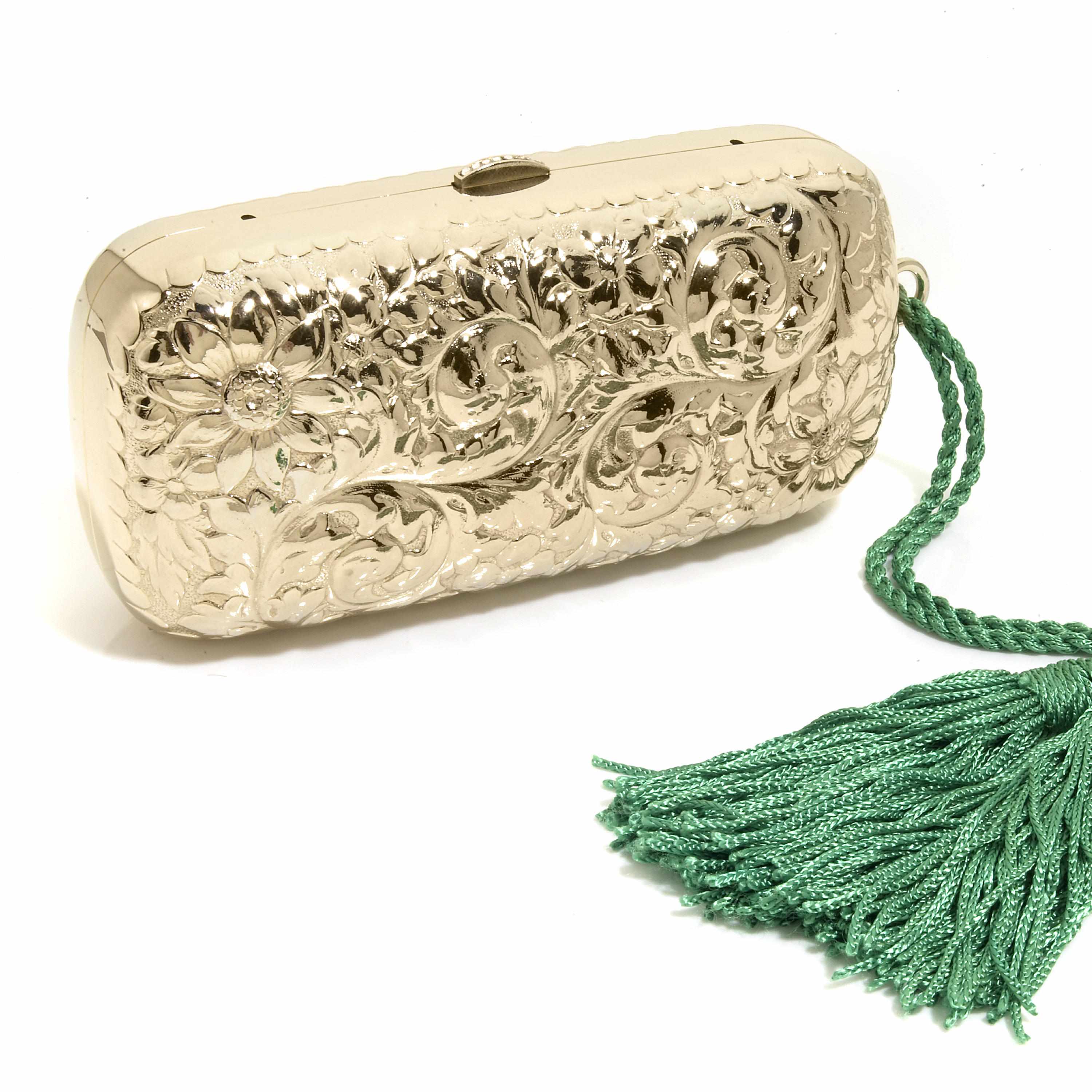 Appraisal: A metal embossed floral purse with a green tassel signed