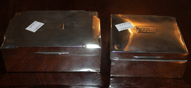 Appraisal: TWO SILVER MOUNTED CIGARETTE BOXES with engine turned decoration