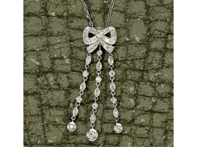 Appraisal: DIAMOND BOW NECKLACE Diamond dangle bow necklace k white gold