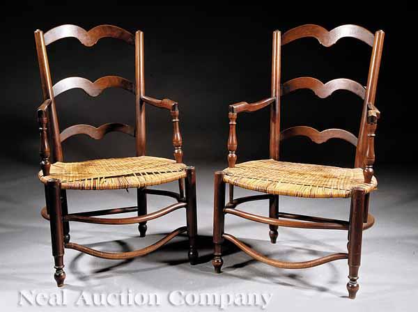 Appraisal: Two French Provincial Walnut Armchairs th c arched tapered splat