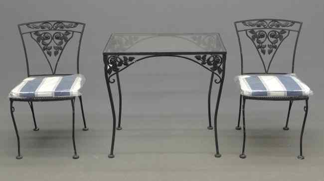 Appraisal: Wrought iron patio table and two chairs