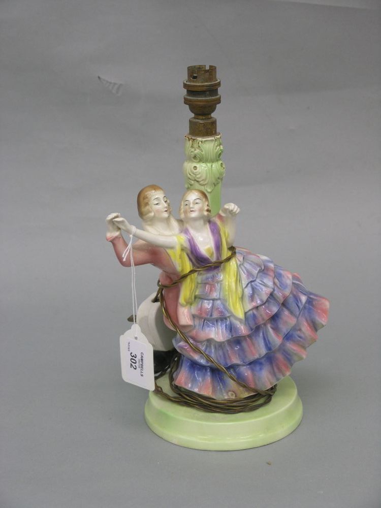 Appraisal: A Goebel earthenware figural table lamp the stem modelled with