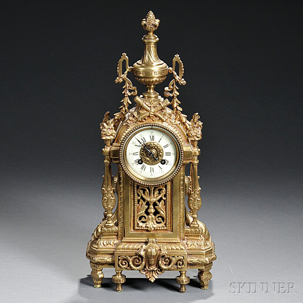 Appraisal: French Cast Brass Shelf Clock S Marti c pineapple-topped urn