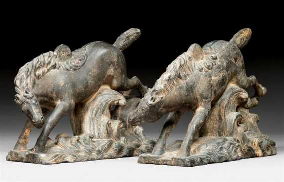 Appraisal: A PAIR OF STONE HORSES ON WAVES PART OF A