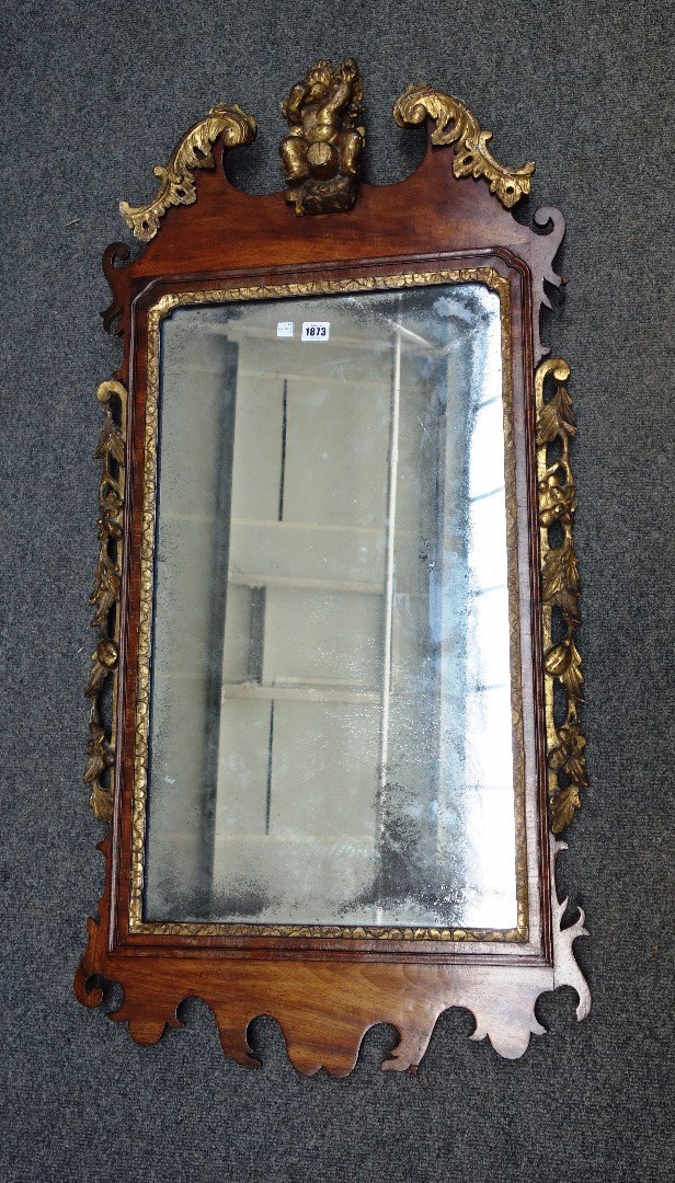 Appraisal: A th century parcel gilt walnut framed fret cut wall