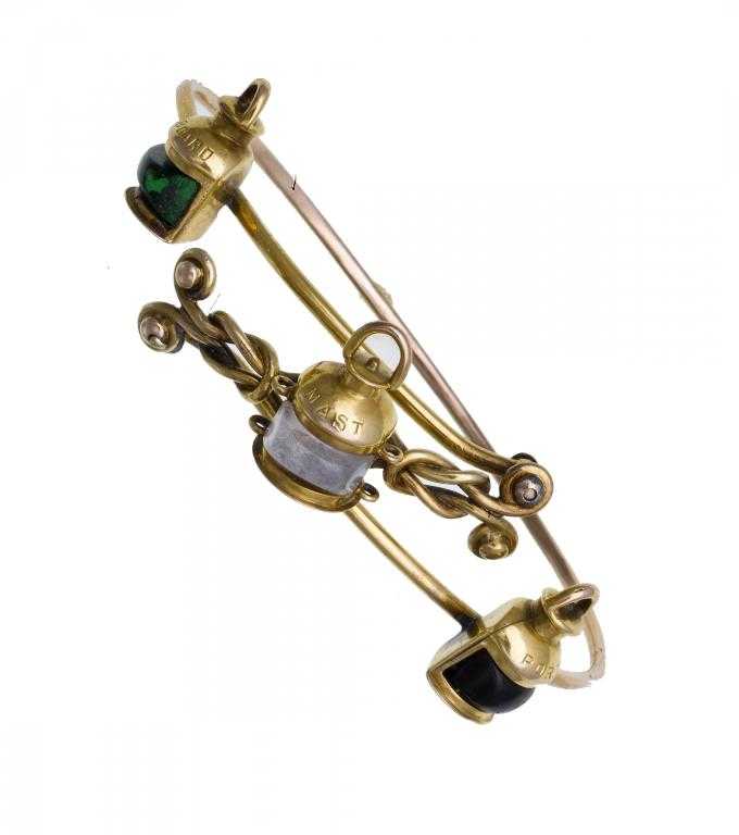 Appraisal: A GEM SET GOLD WIREWORK BRACELET applied with three miniature