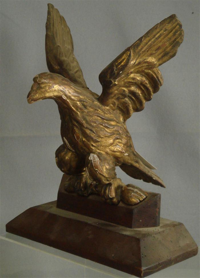 Appraisal: Carved gilt wood spread wing eagle on wooden platform base