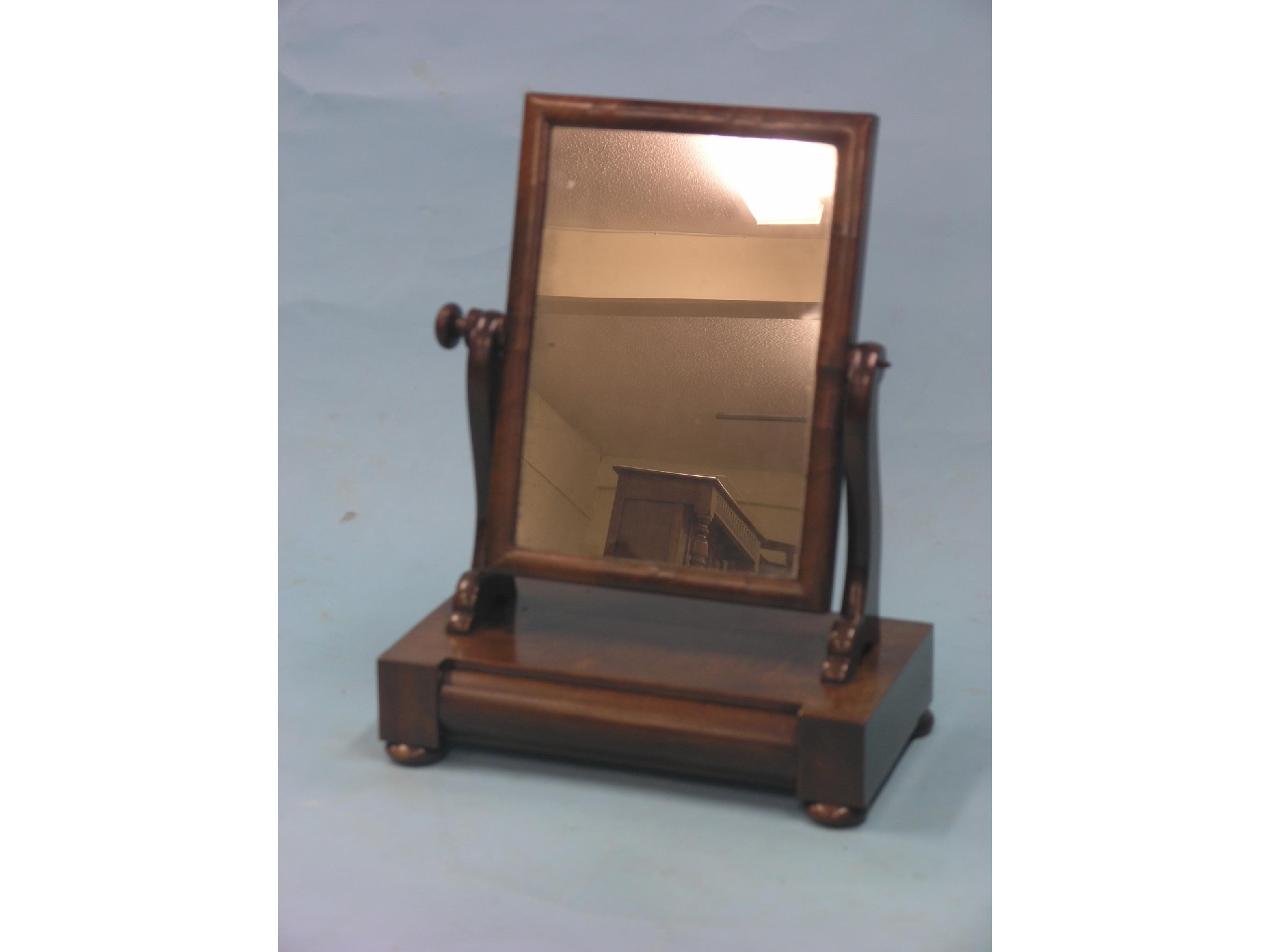 Appraisal: A Victorian mahogany toilet mirror rectangular plate adjustable on scroll