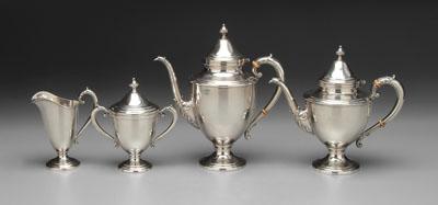 Appraisal: Four-piece sterling tea service urn form with acanthus decoration urn