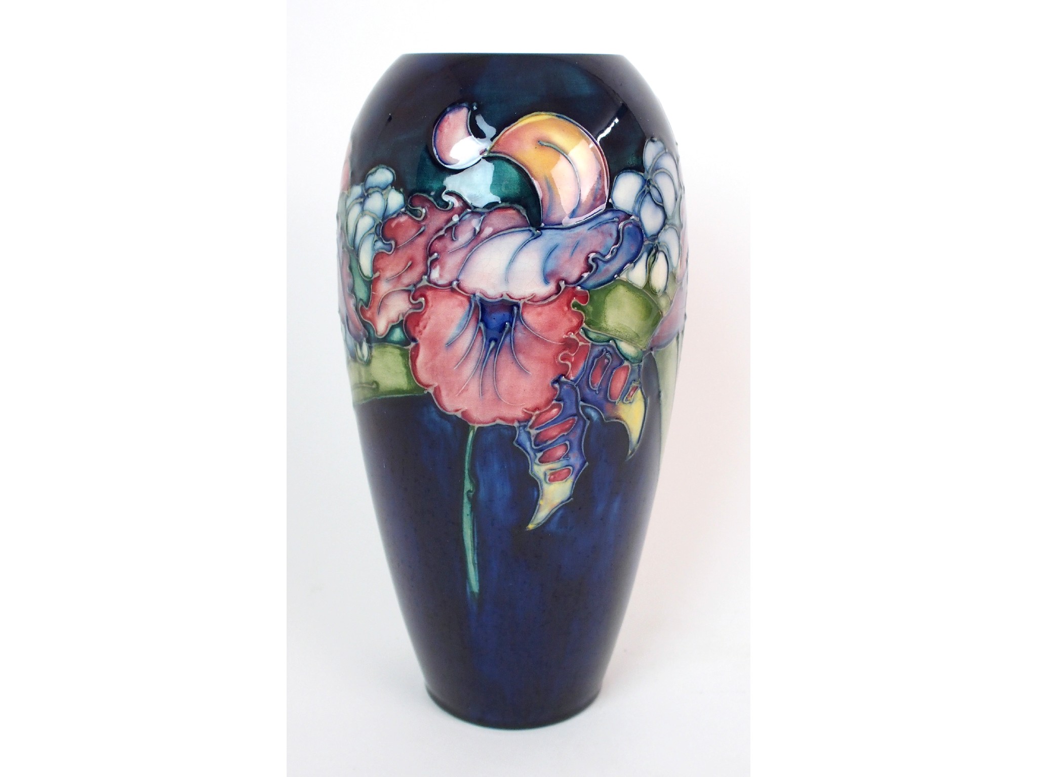 Appraisal: A Moorcroft Pottery Orchid vasebaluster-form with orchids circumventing body on